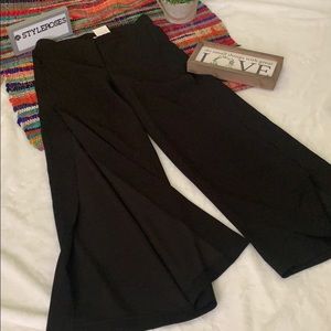 Black pants w/ flowing legs/ with slits on the legs- classy